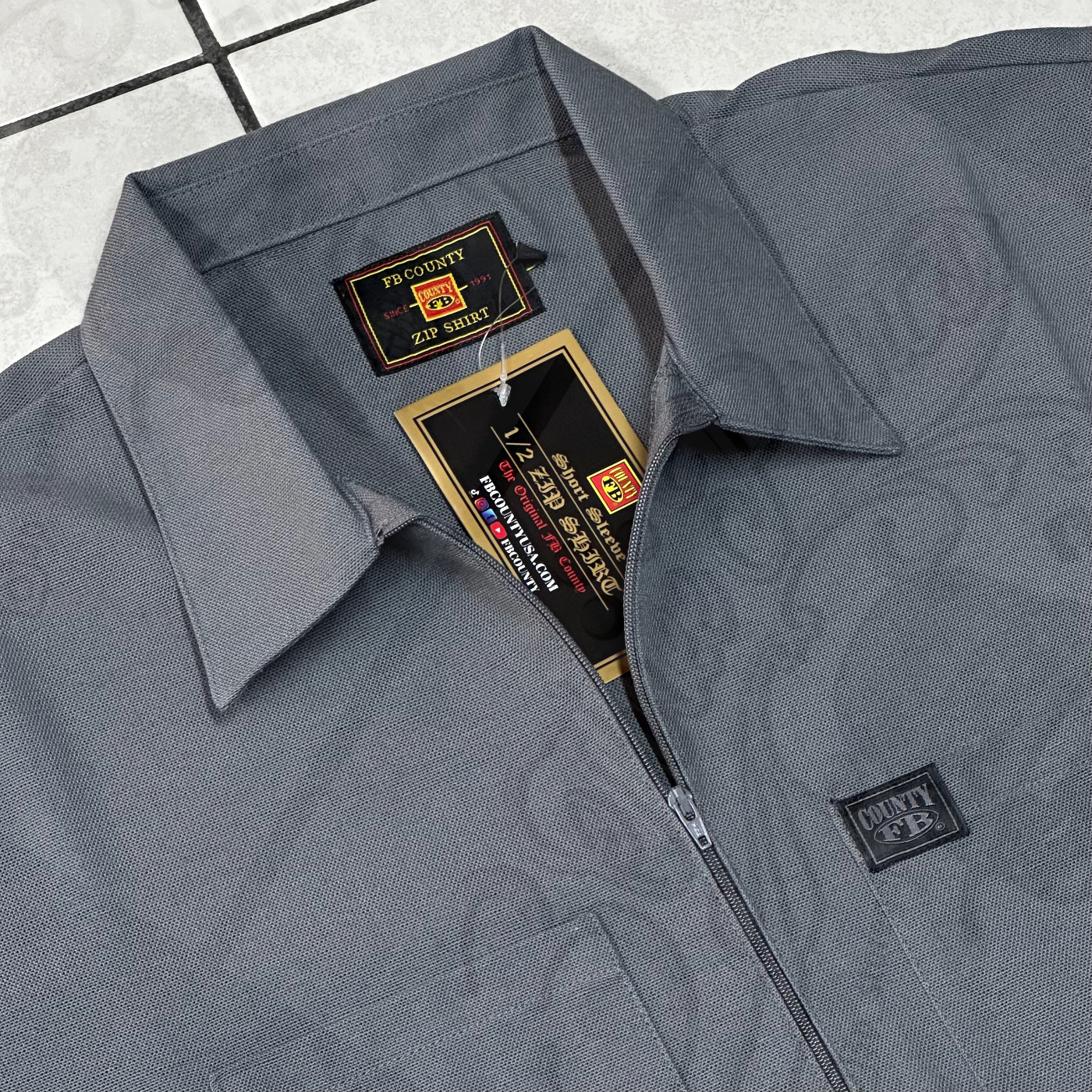 FB COUNTY “SOLID” MANGA CORTA 1/2 ZIPPER