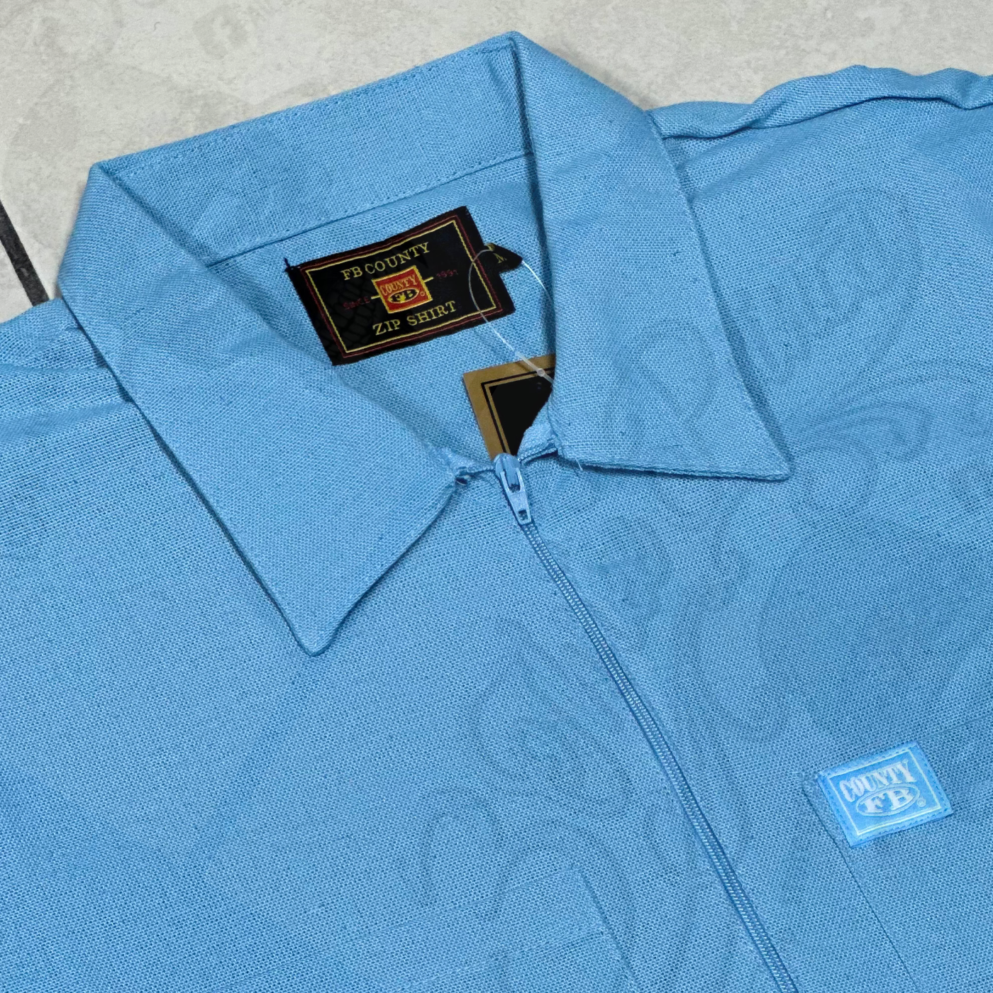 FB COUNTY “SOLID” MANGA CORTA 1/2 ZIPPER