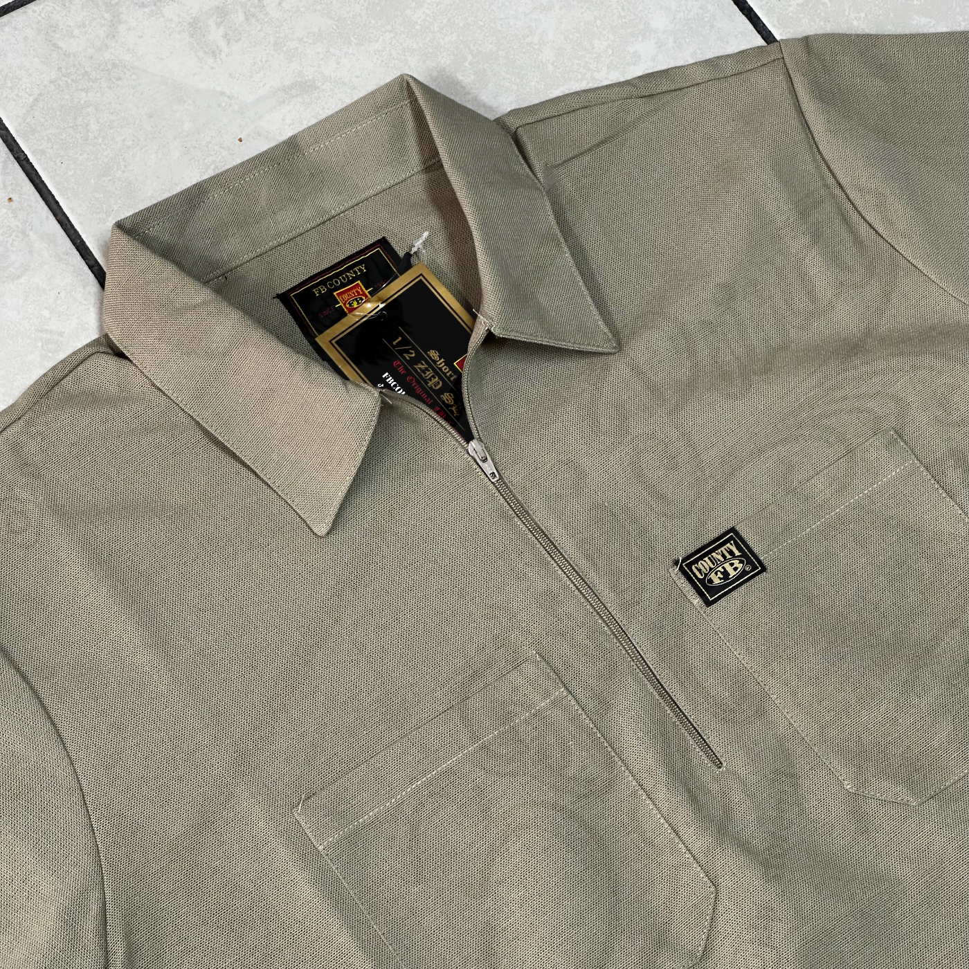 FB COUNTY “SOLID” MANGA CORTA 1/2 ZIPPER