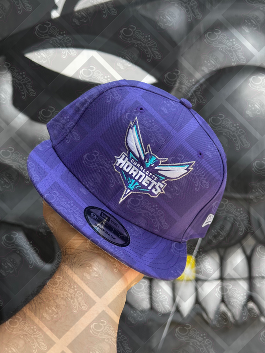 GORRA NEW ERA 9FIFTY SNAPBACK “HORNETS”
